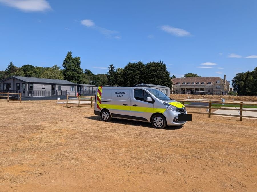 CaraNation escort vehicle at a delivery site
