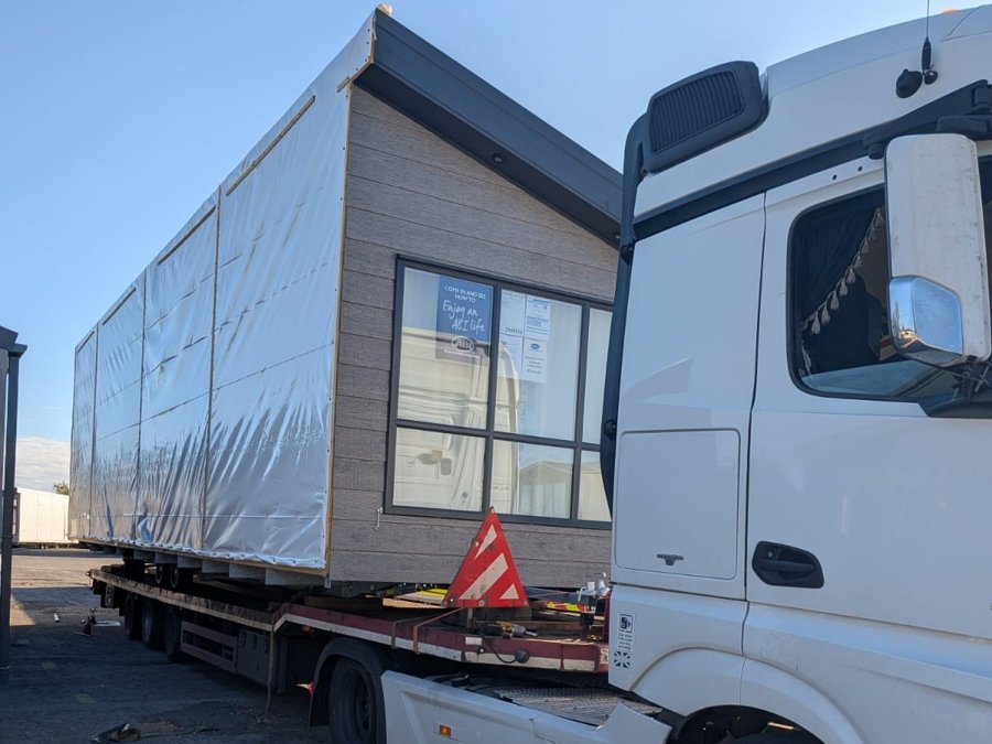 Twin unit being transported on a low-loader